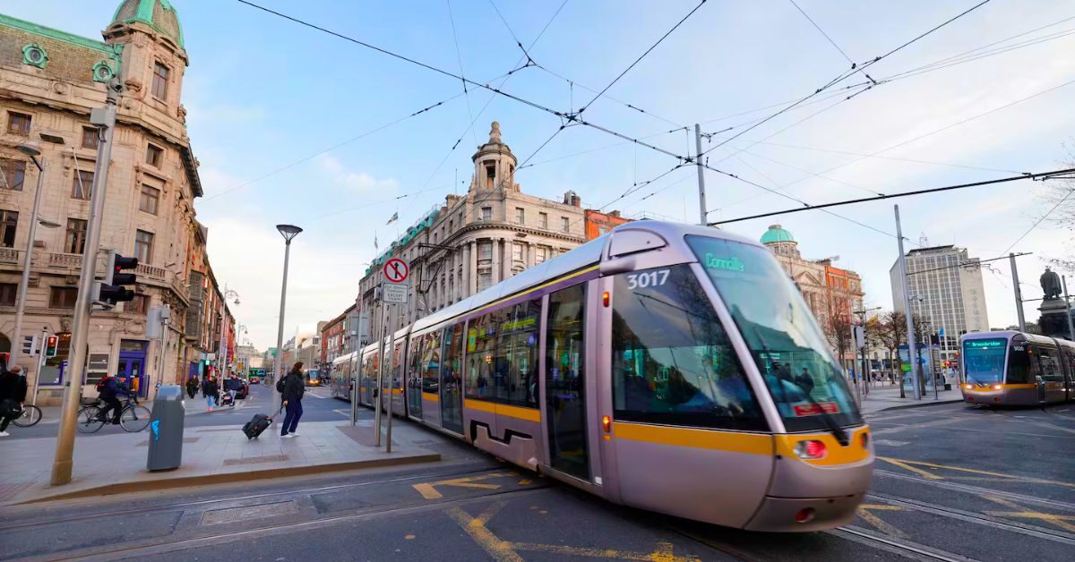 Guests explore vibrant city streets with modern tram access, historic architecture, and bustling urban energy near the hotel.